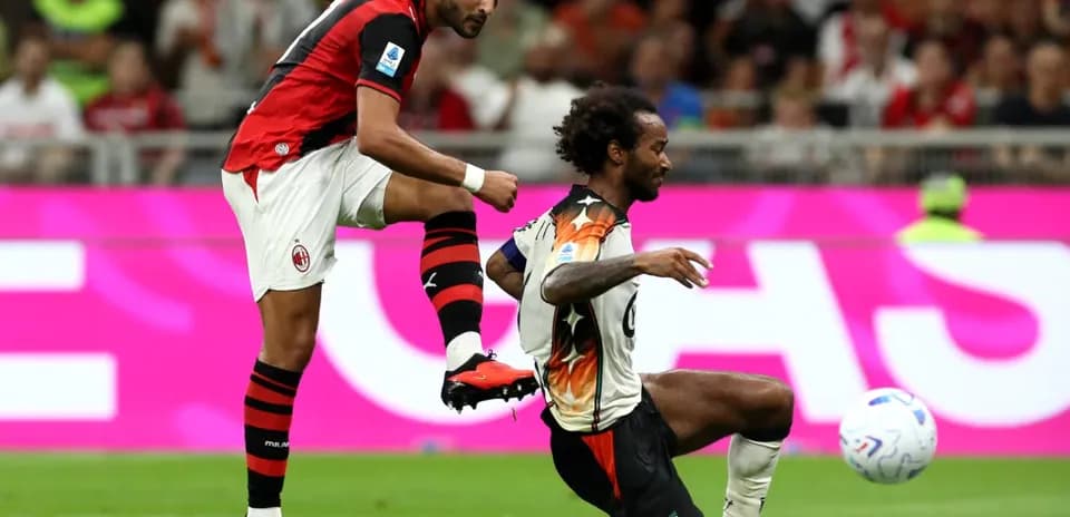AC Milan player kicking the ball during match