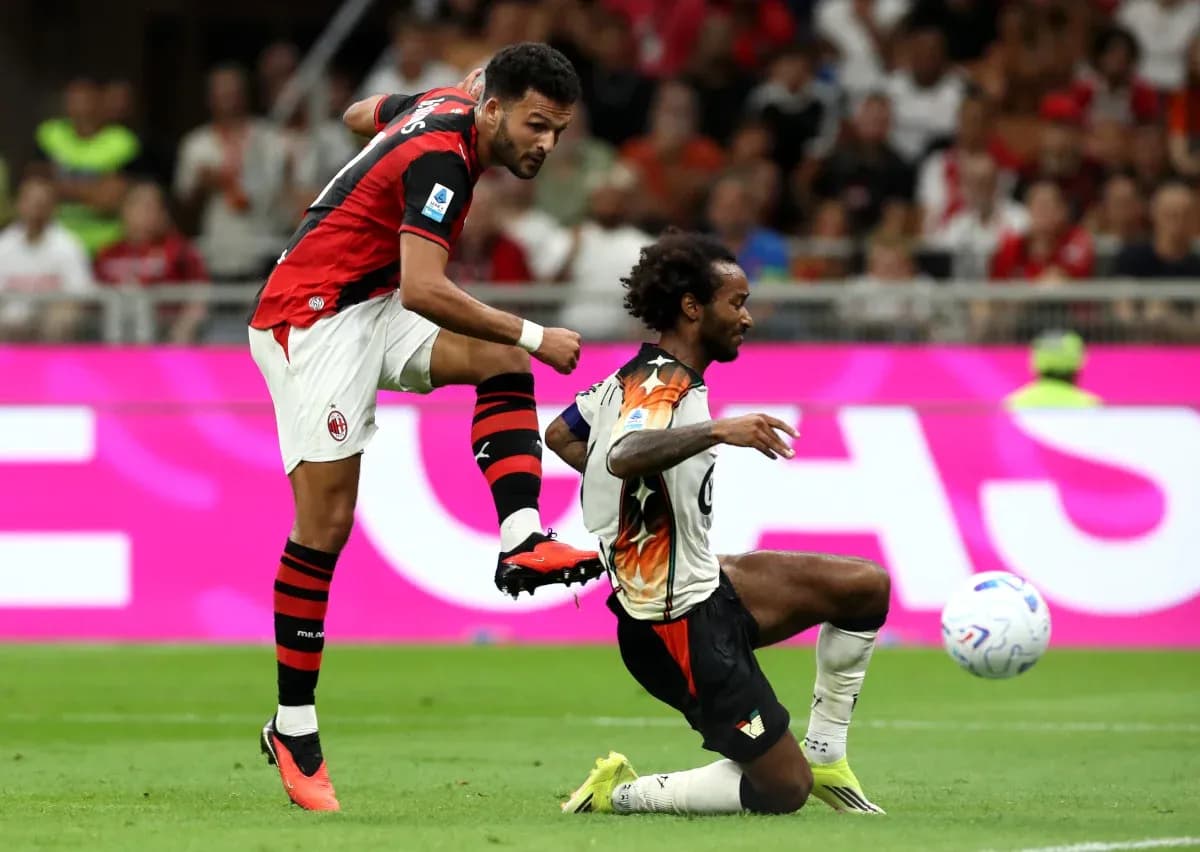 AC Milan player kicking the ball during match