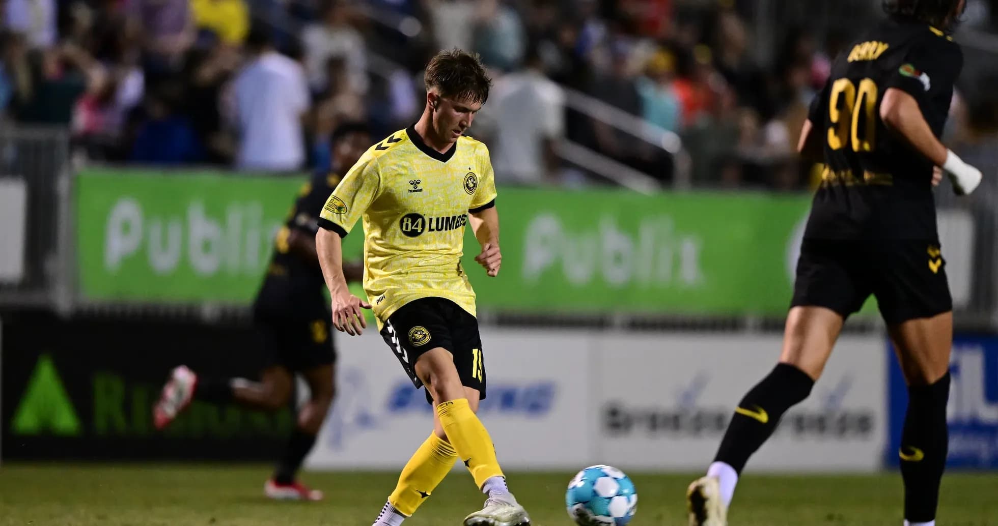 Player kicking the ball during USL match