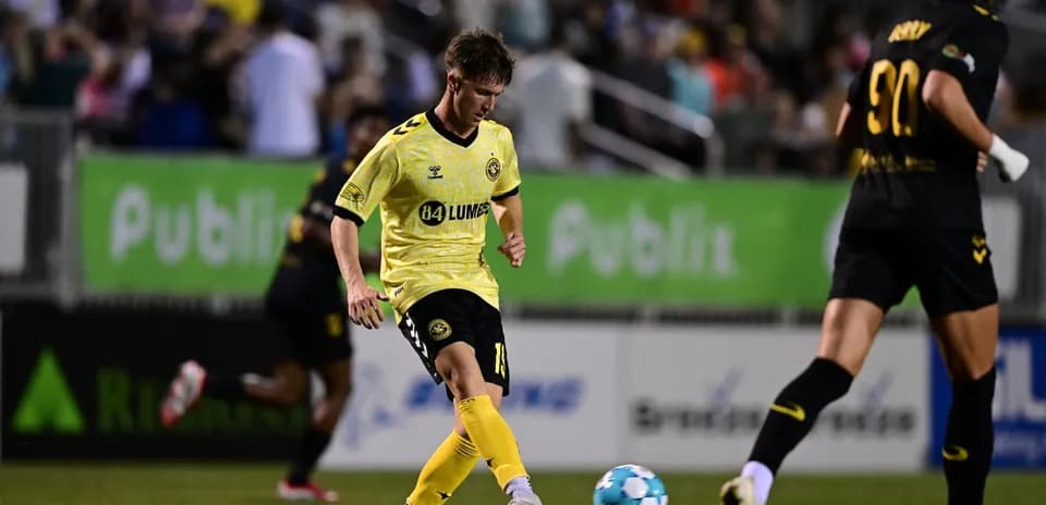 Player kicking the ball during USL match
