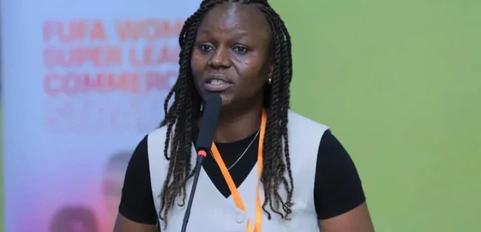 Woman speaking at FUFA Women's Super League event