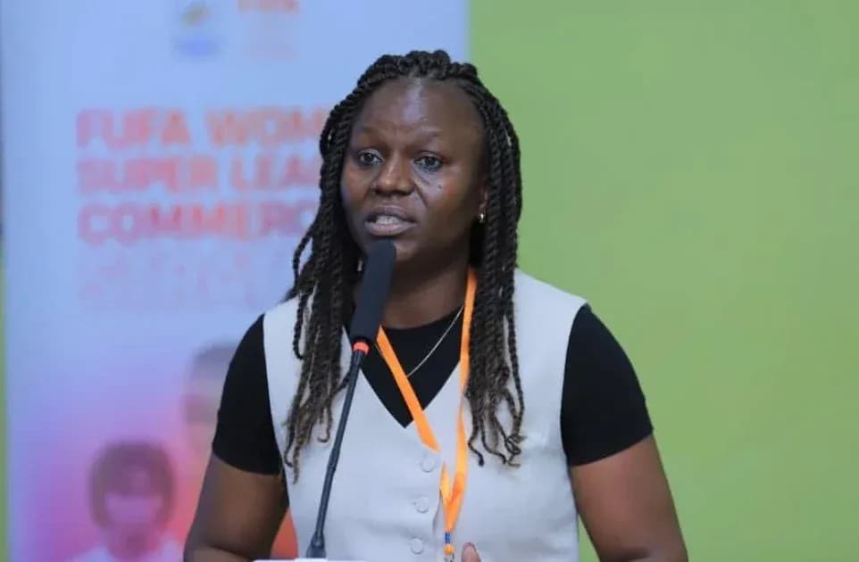 Woman speaking at FUFA Women's Super League event