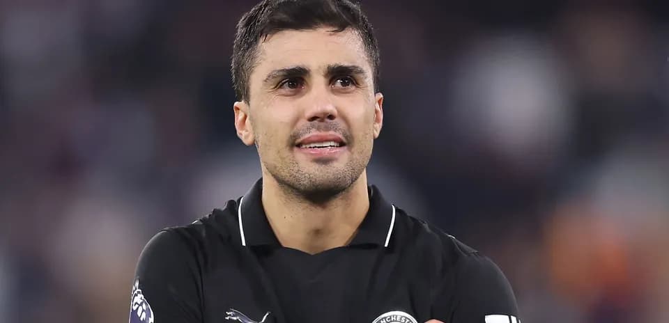 Player in black jersey looking up after match