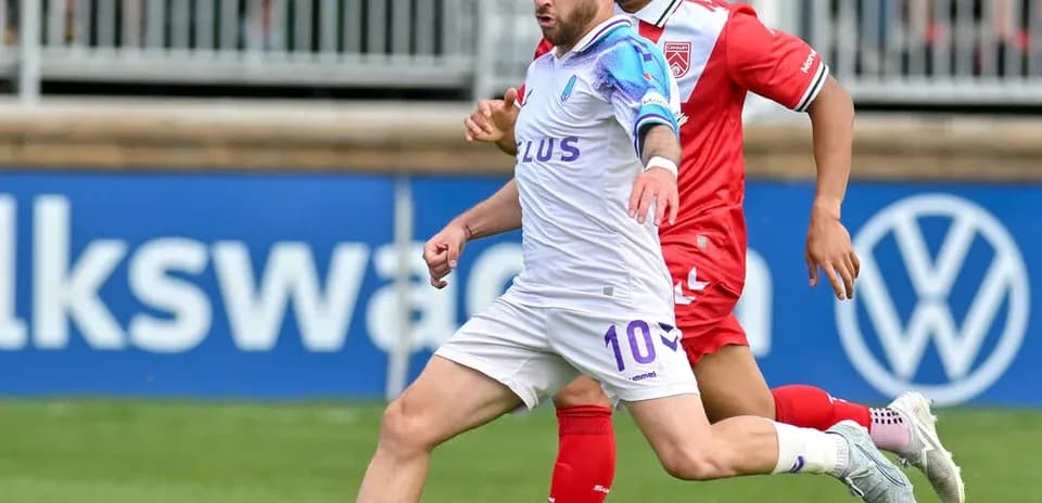 Player dribbling the ball during Cavalry FC match
