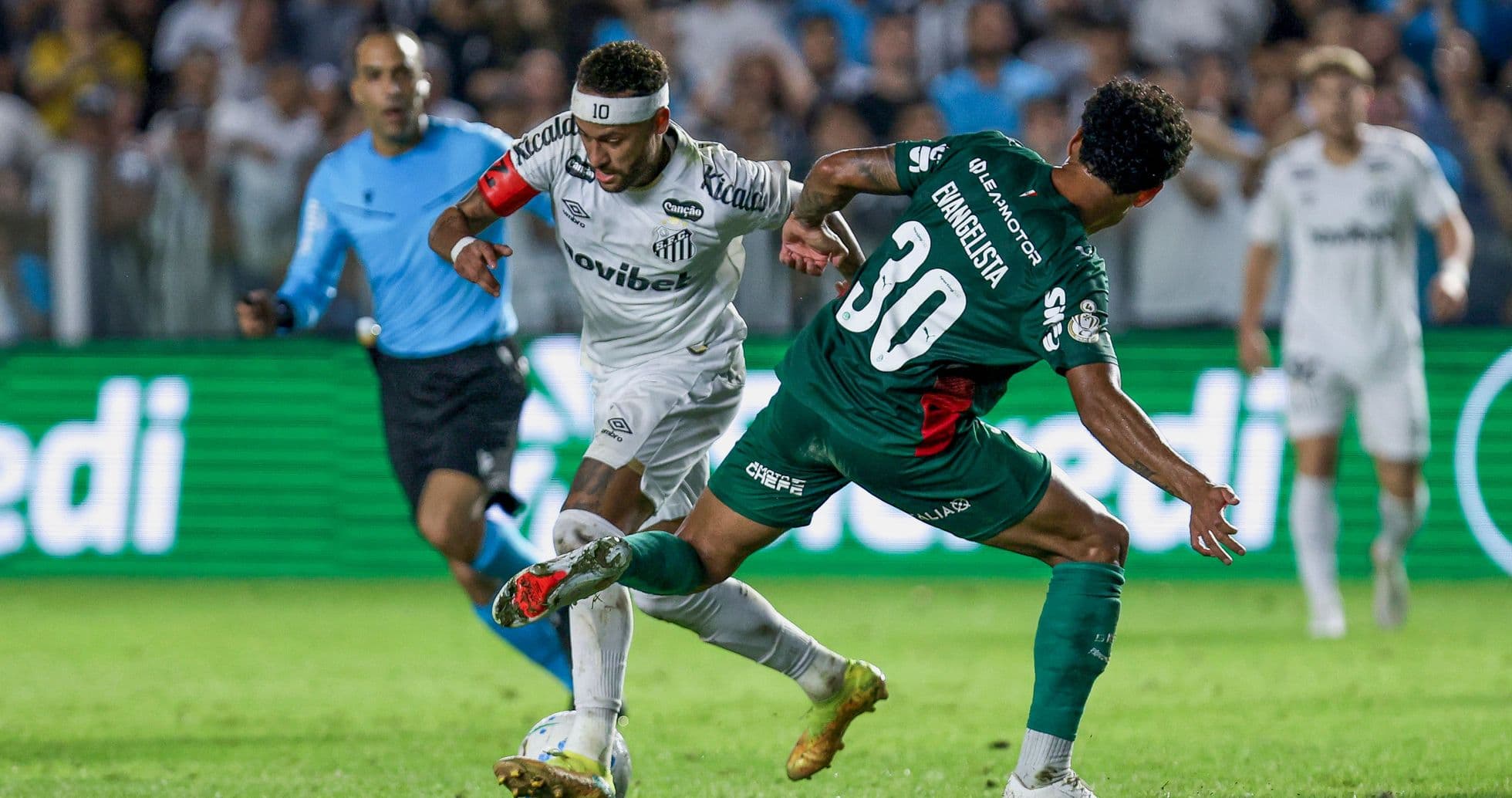 Neymar dribbling past defender during match action