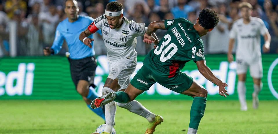 Neymar dribbling past defender during match action