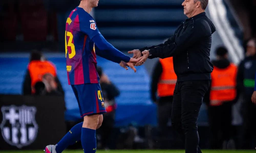 Player receiving handshake from coach during substitution