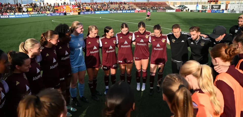 Detroit City players in team huddle before match