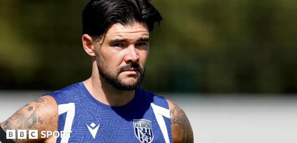 Football player training in West Bromwich Albion kit