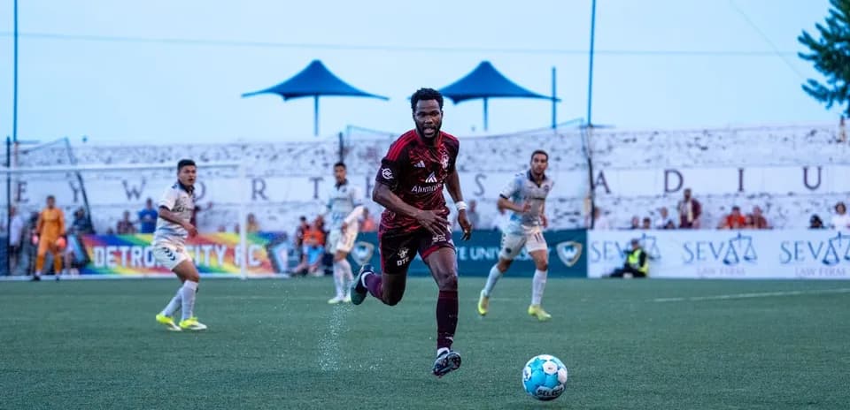 Player dribbling the ball during Detroit City match