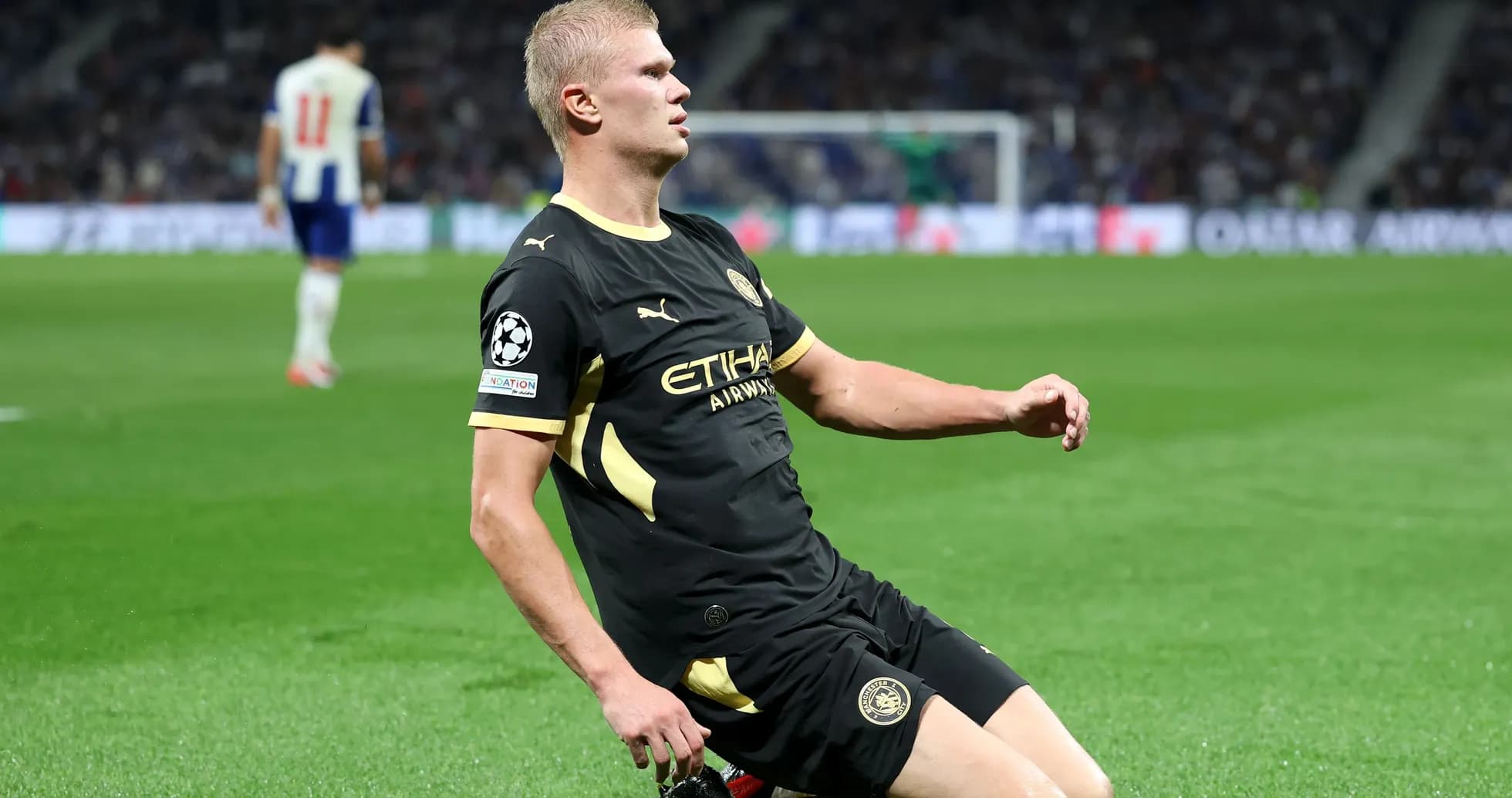 Player sliding on the pitch during a match