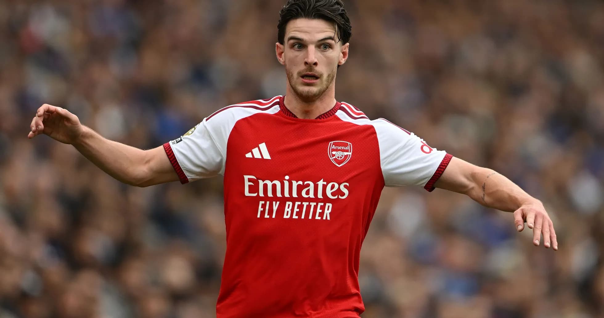 Player in Arsenal kit gesturing during match