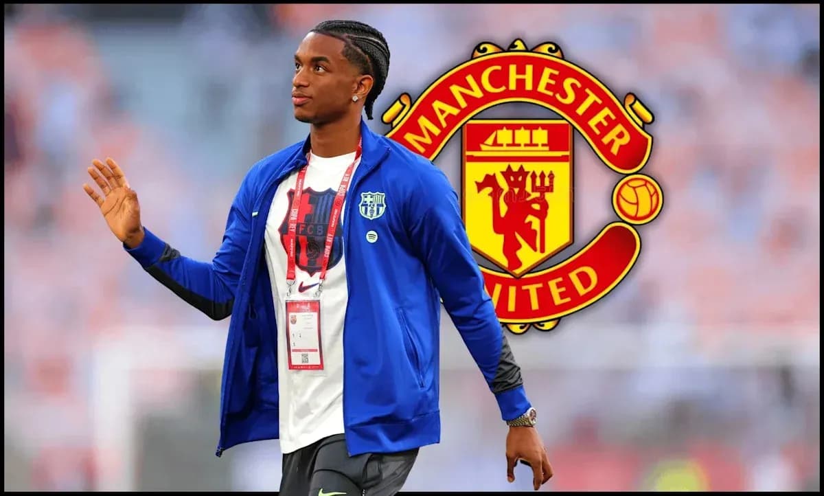 Player walking with Manchester United logo in background