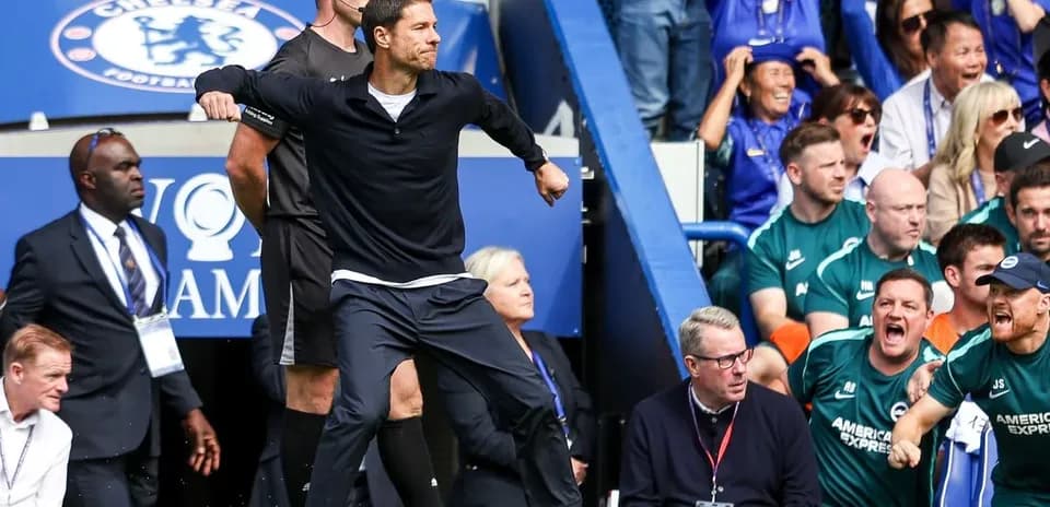 Coach celebrating on the sidelines during match