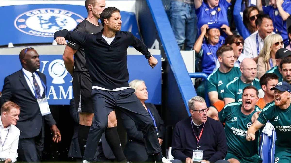Coach celebrating on the sidelines during match