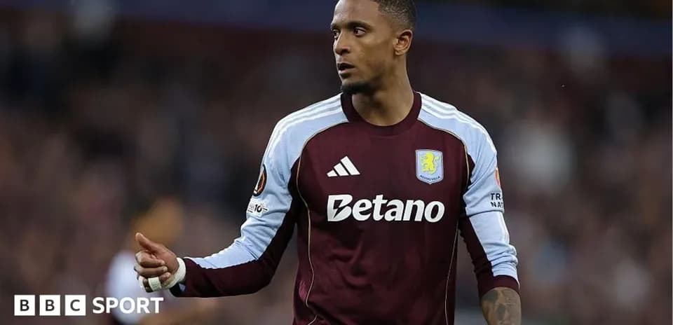 Player in Aston Villa kit gesturing during match