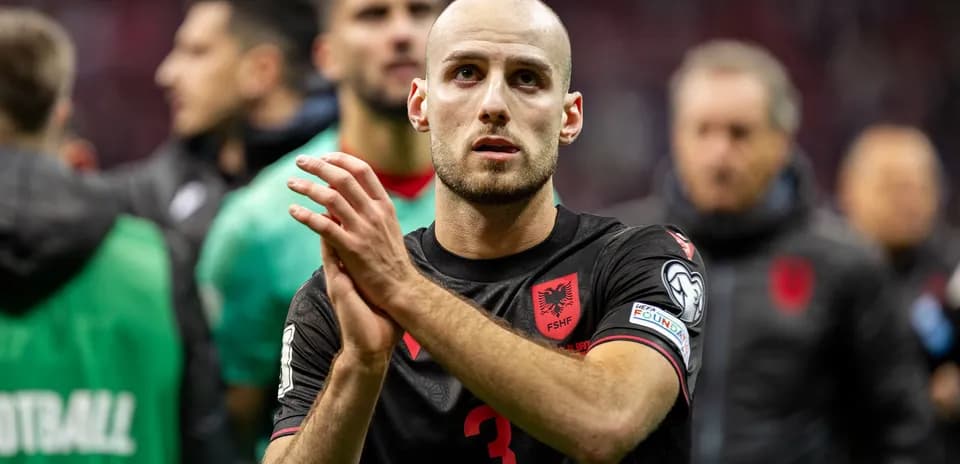 Albanian player applauding after a match
