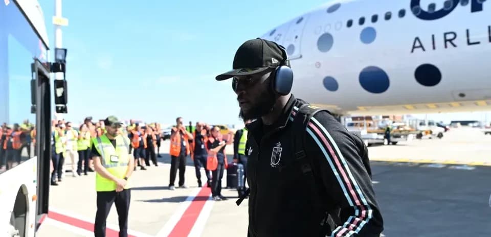 Player walking towards airplane at airport