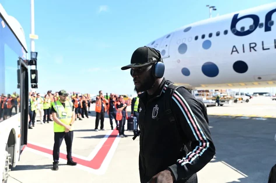 Player walking towards airplane at airport