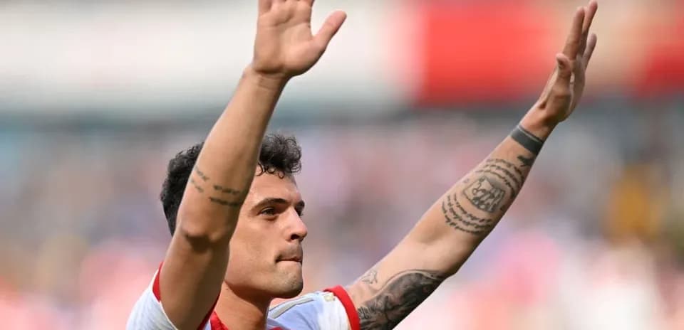 Player waving to fans after the match