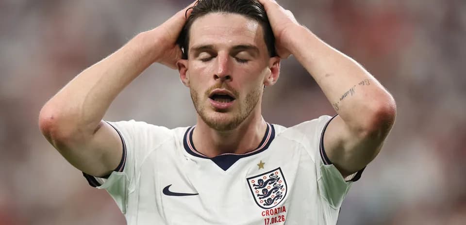 Player holding head in disappointment on field