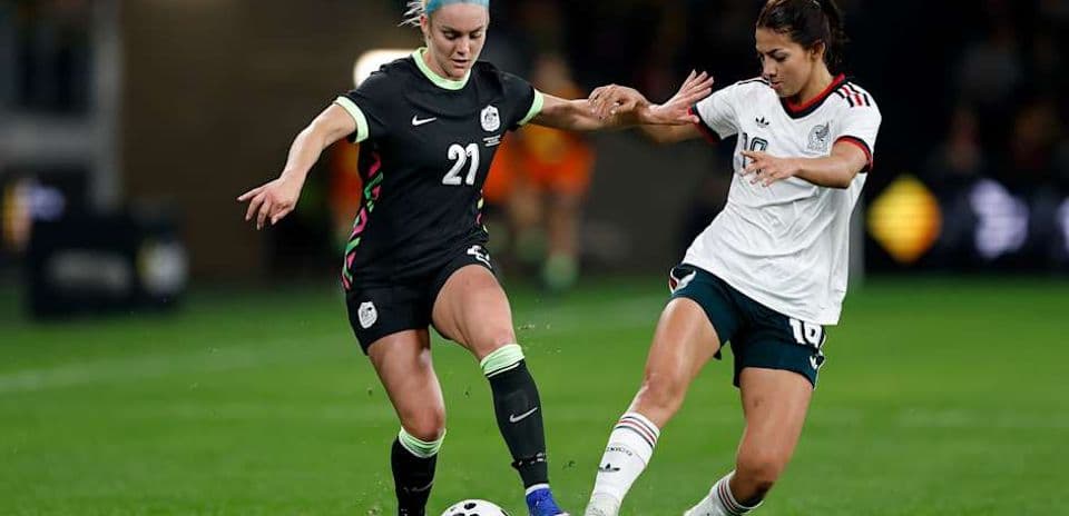 Two players battling for the ball during soccer match
