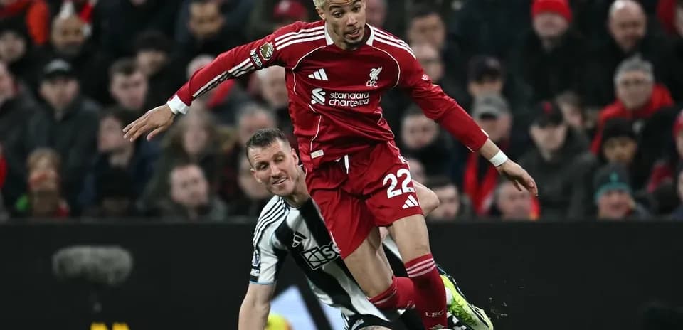 Liverpool player tackled by Newcastle opponent