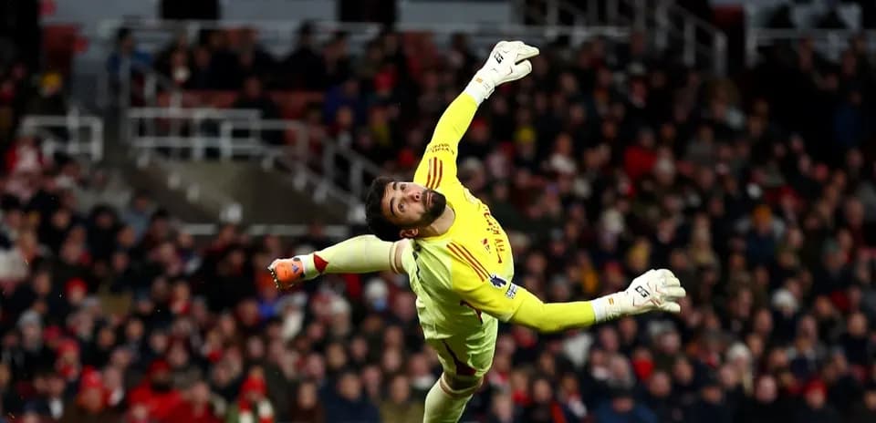 Goalkeeper diving to make a save during match