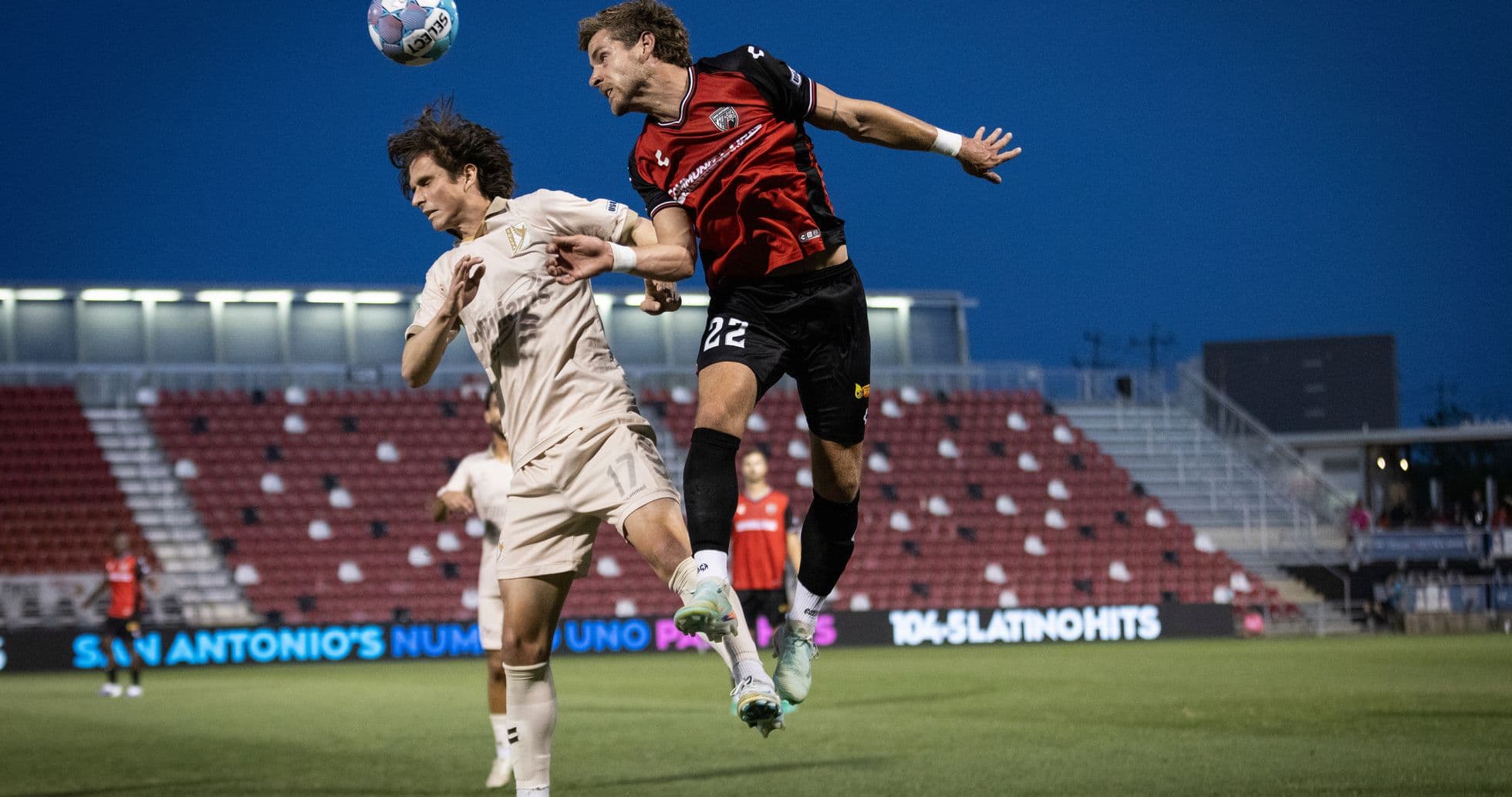 Player heading the ball during FC Tulsa match