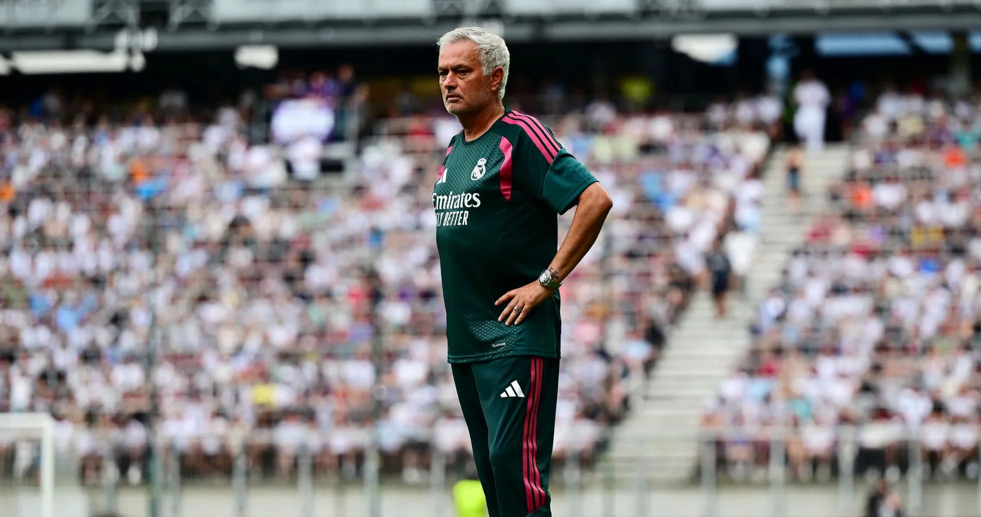 Coach observing from sideline during match