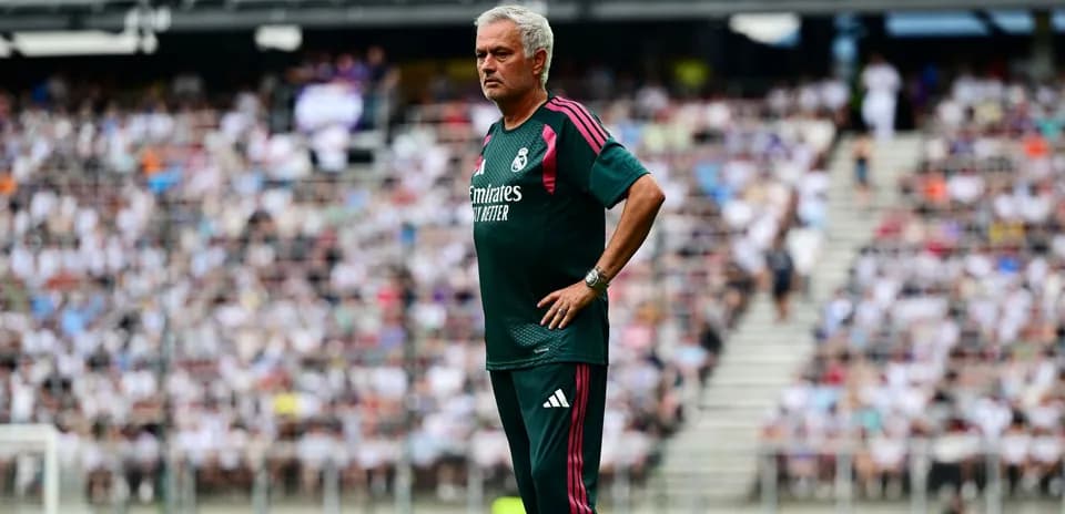 Coach observing from sideline during match