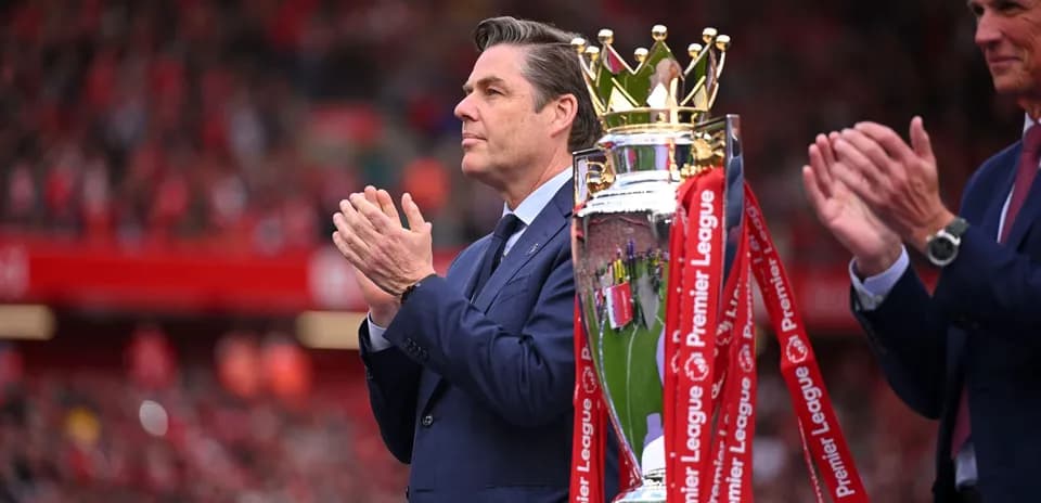 Official presenting Premier League trophy at ceremony