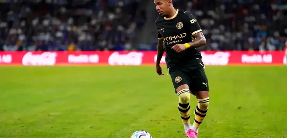 Player dribbling ball during match on field