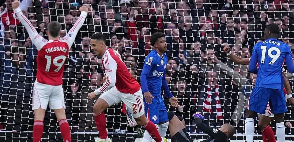 Arsenal players celebrating a goal against Chelsea