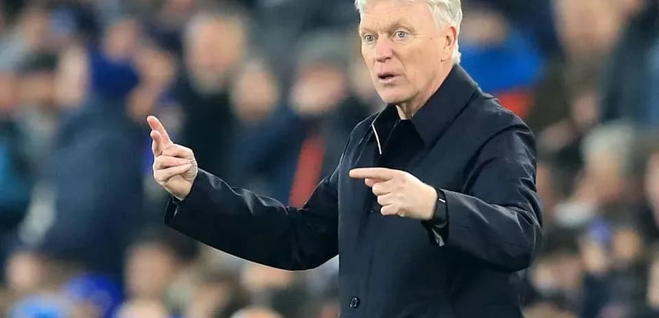 Manager directing players during a match