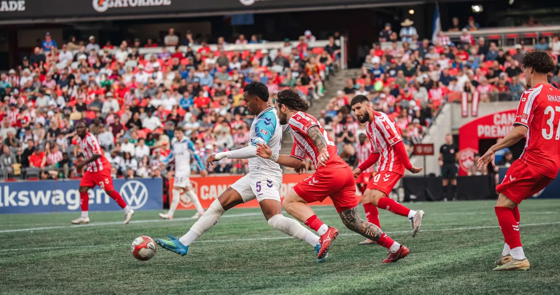 Players competing for the ball during match