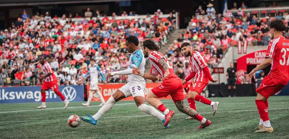 Players competing for the ball during match