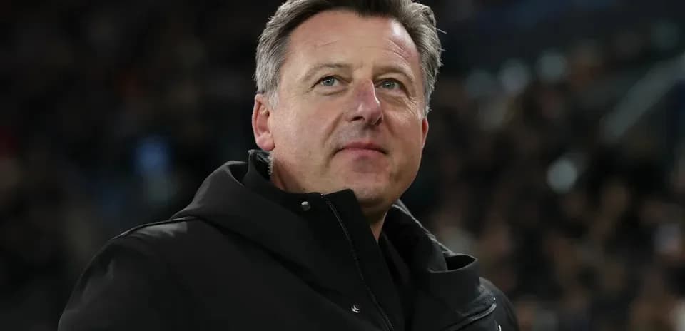 Coach observing the game from the sidelines