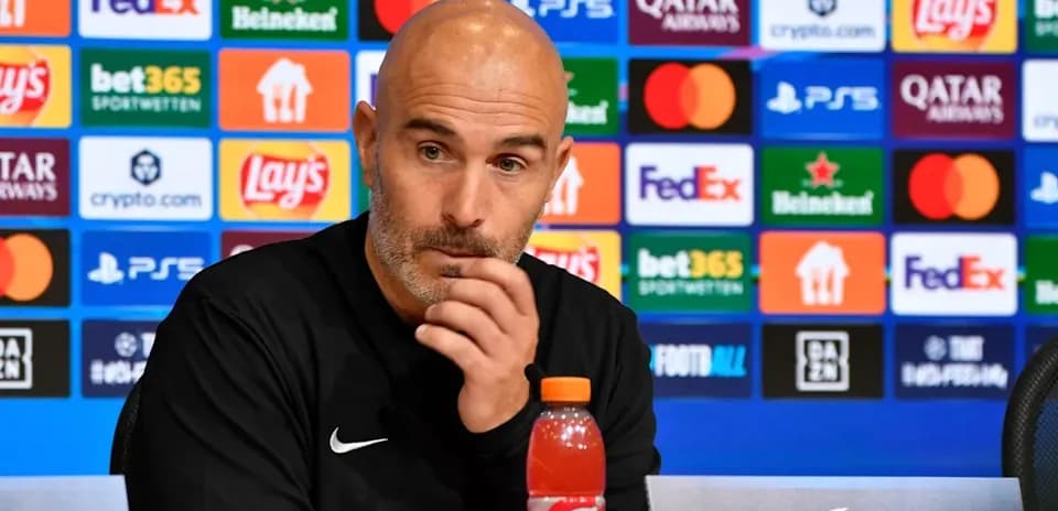 Coach speaking at UEFA Champions League press conference