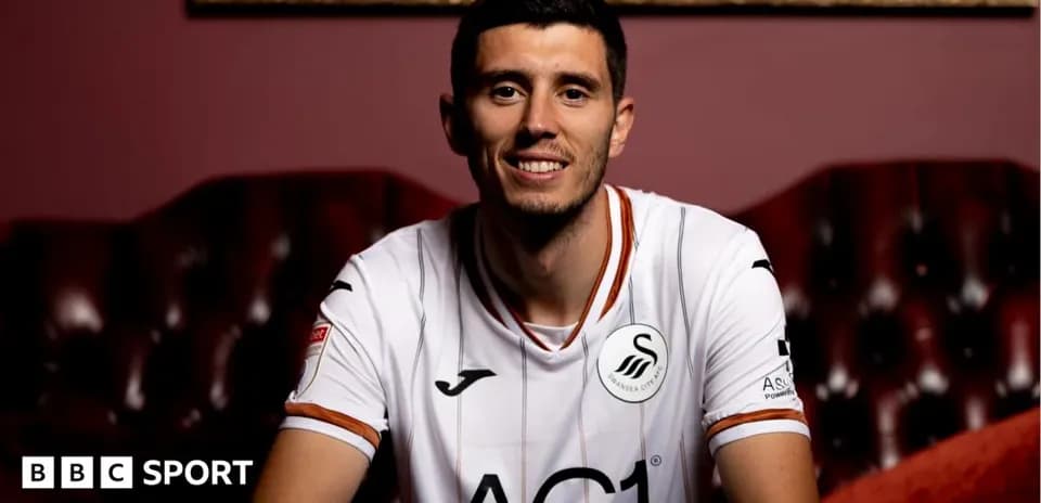 Player in Swansea City jersey smiling for portrait