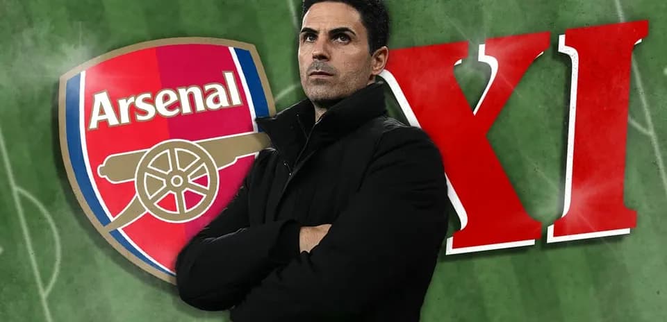 Arsenal logo with coach standing on green pitch