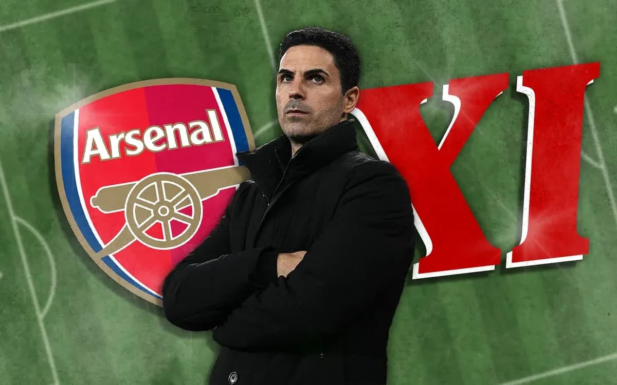 Arsenal logo with coach standing on green pitch