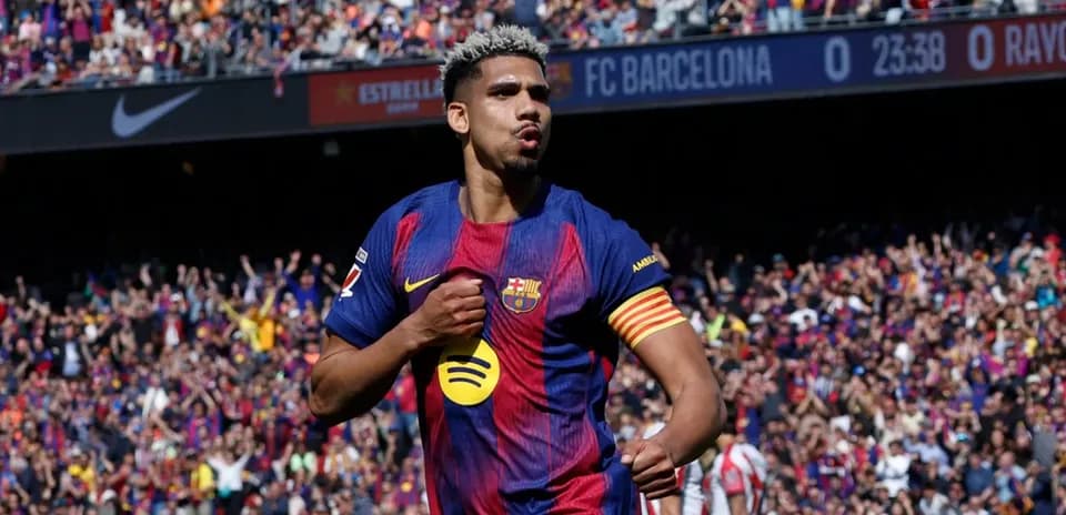 Player celebrating goal with fans in stadium
