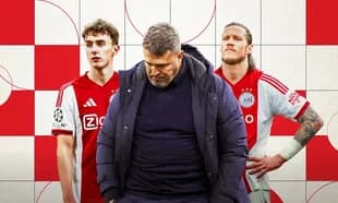 Ajax coach with players in club jerseys and background