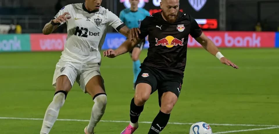 Two players contesting for the ball during match