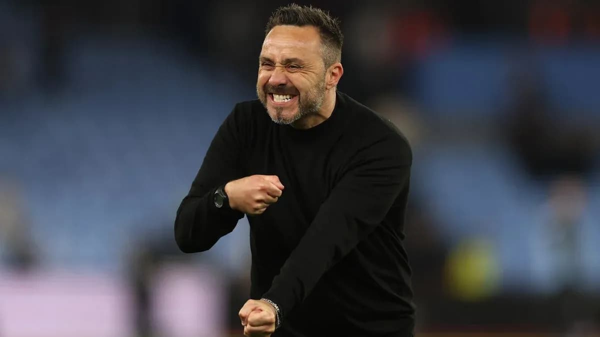 Coach celebrating passionately on the sidelines