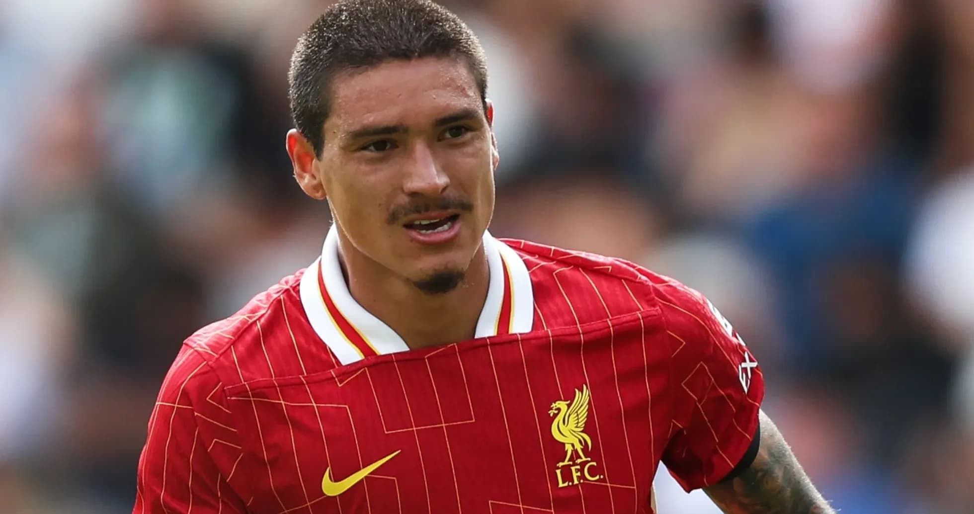 Player in Liverpool jersey during match action