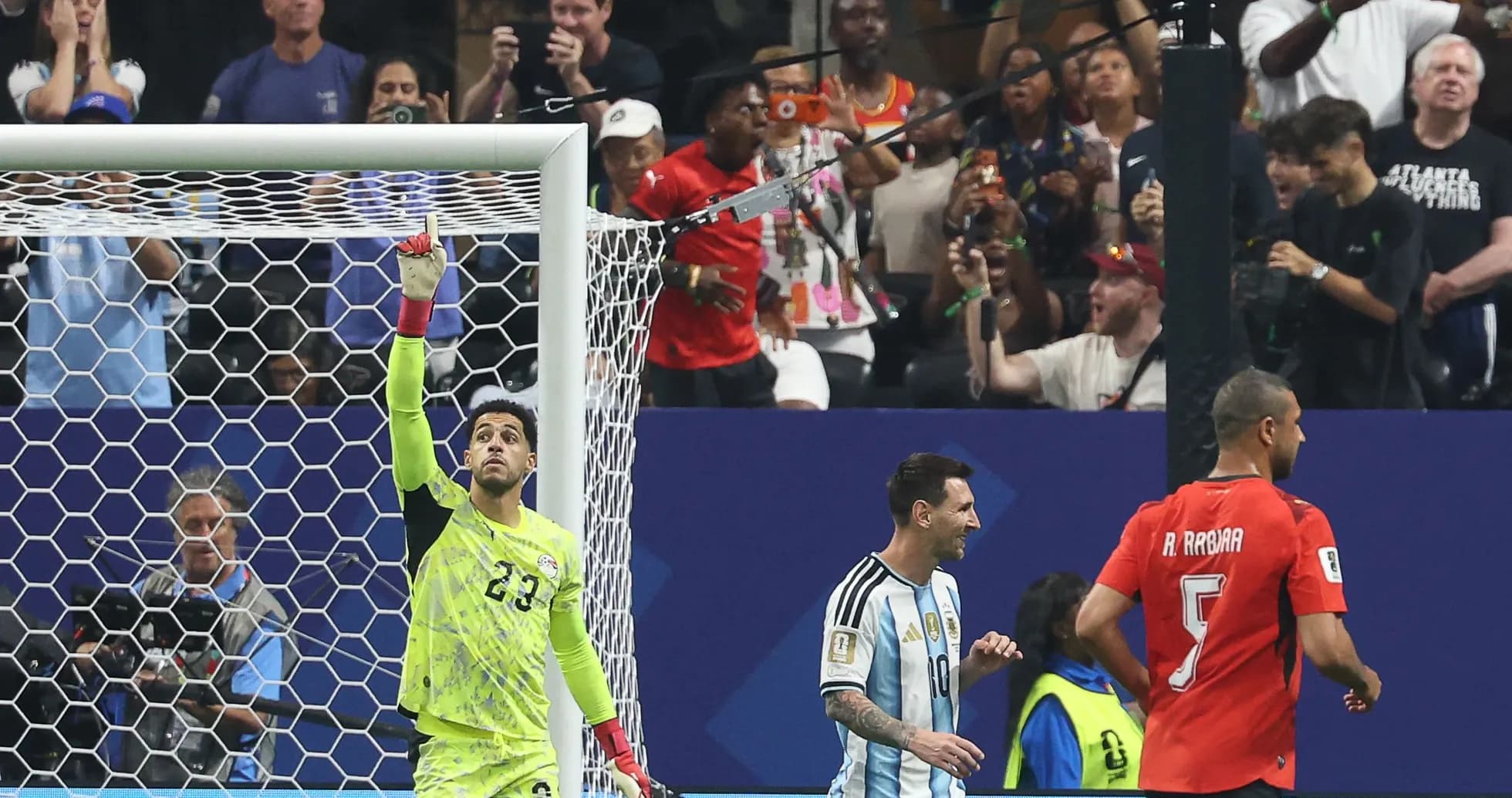 Goalkeeper celebrating with players after a match