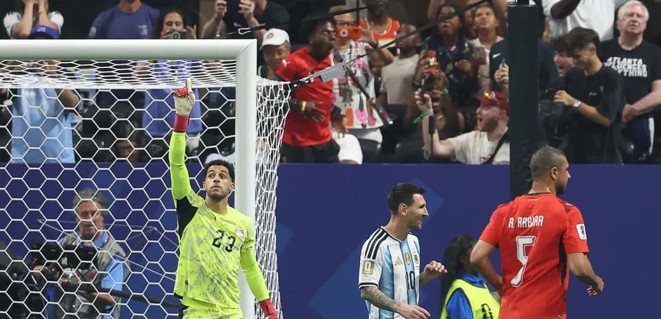 Goalkeeper celebrating with players after a match