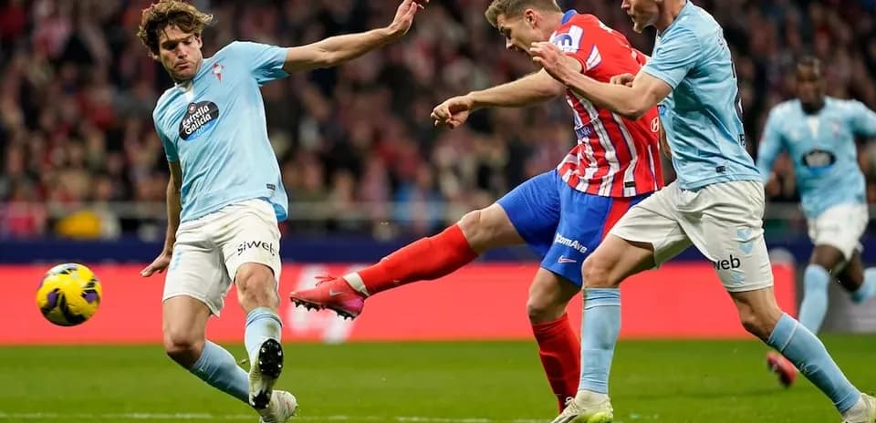 Atletico Madrid player shoots during match against Celta Vigo